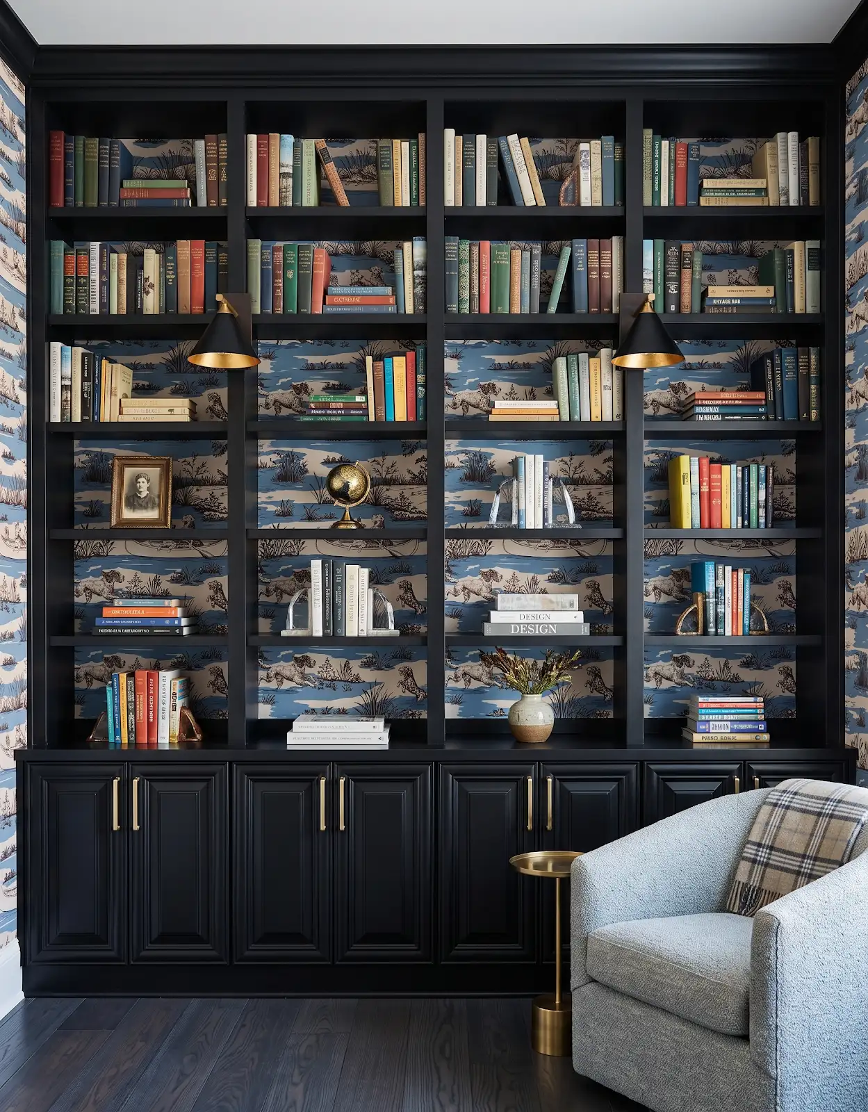 AI-generated room concept with dark bookshelves, framed pictures and a pale blue chair